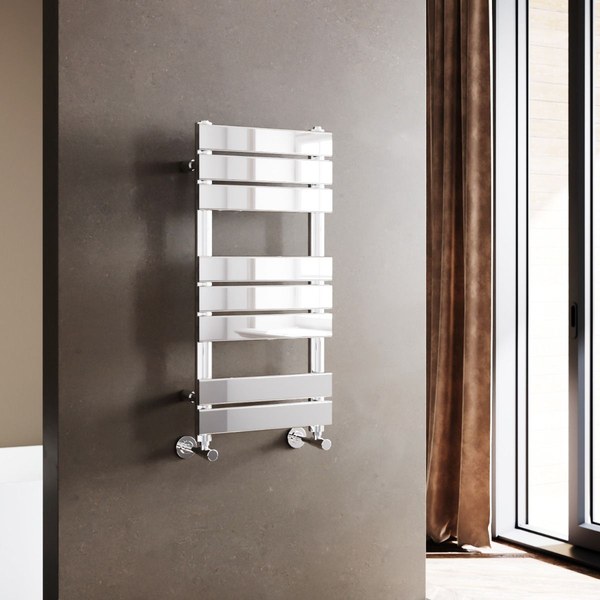 Chrome Elegant Showers flat panel heated towel rail on a dark bathroom wall