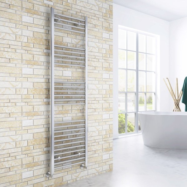 Tall chrome Elegant Showers straight heated towel rail in a bright bathroom