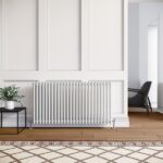 White Elegant Showers traditional 3 column radiator under a window in a panelled living room