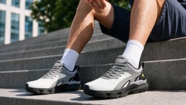 Man walking up outdoor steps in FitVille Rebound Nova Edge walking shoes