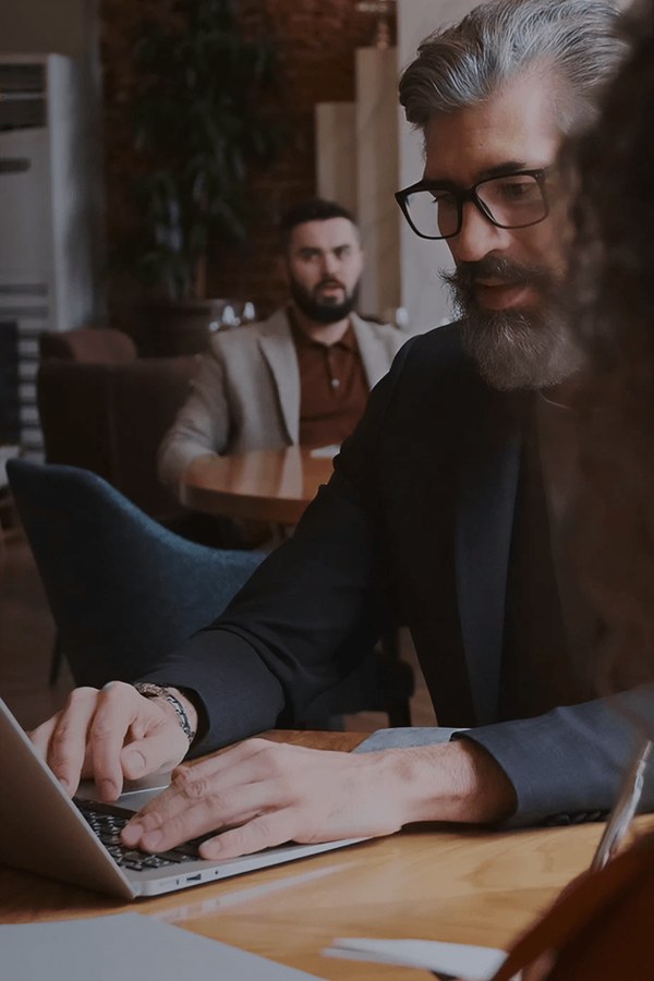 Man working on a laptop at home, from Superloop internet