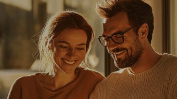 Couple relaxing on a sofa at home looking at a tablet together, from Superloop residential internet