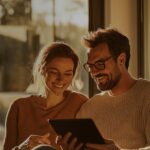 Couple using a tablet together at home on a fast internet connection