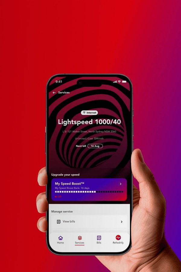 Hand holding a phone with the Superloop app open on a red and purple background